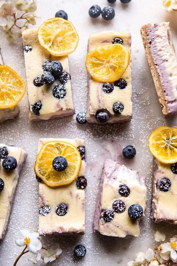 Blueberry lemon cheesecake bars with candied lemon
