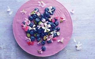 Blueberry lemon mousse cake with scented geranium flowers