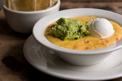 Bob Armstrong dip (Queso with taco meat, guacamole, and sour cream)