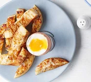 Boiled egg with] Marmite & gooey cheese crumpet soldiers