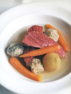 Boiled salt beef with carrots and dumplings