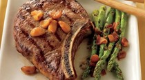 Bone-in rib-eye steaks with sweet, pan-roasted garlic
