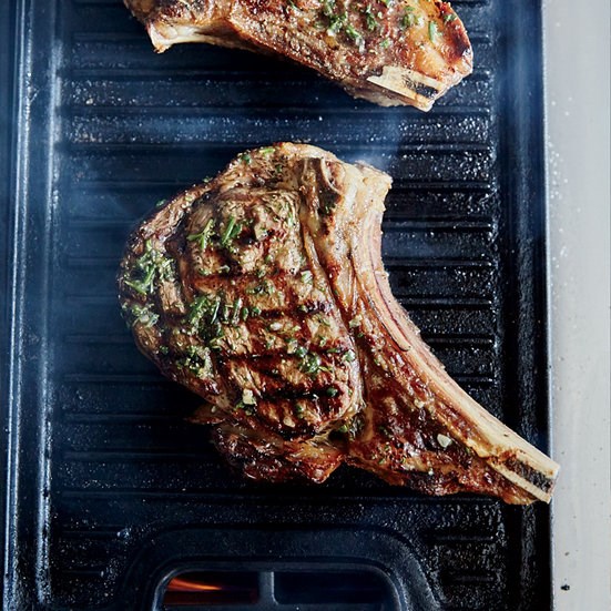 Bone-in rib eye steaks with grilled onion jam