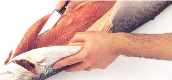 Boning through the stomach of whole round fish