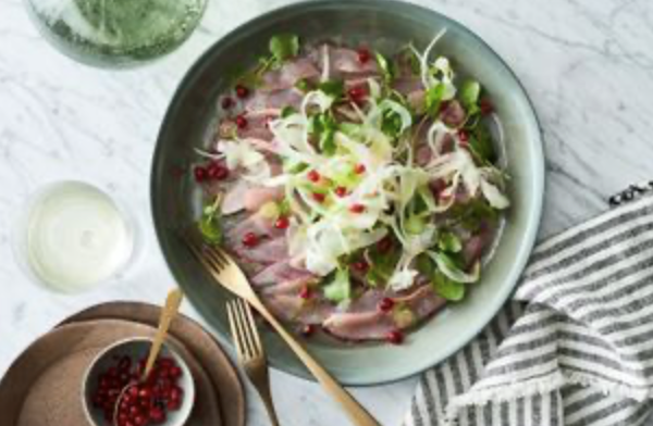 Bonito carpaccio with pomegranate, fennel and wild leaves