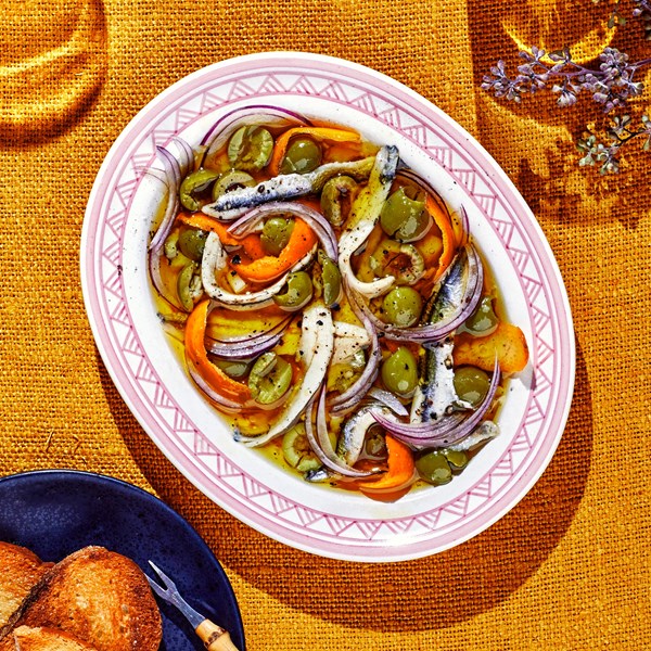 Boquerones with green olives and orange 