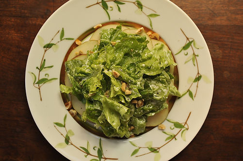 Boston greens with tarragon buttermilk dressing, red pears, and toasted hazelnuts