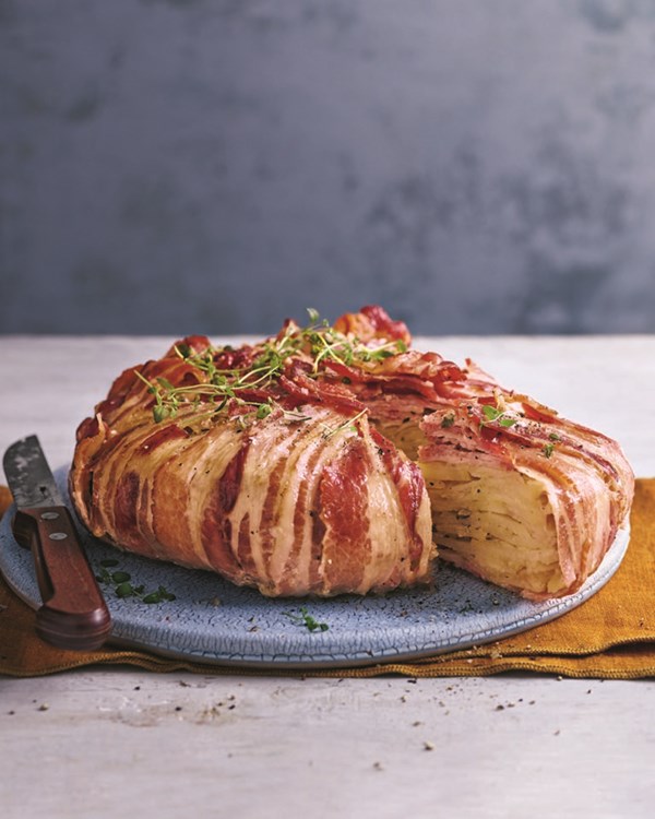 Boulangère potatoes wrapped in streaky bacon