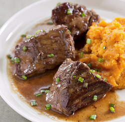 Bourbon-butter steak tips with maple mashed sweet potatoes