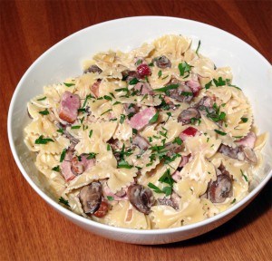 Bow tie pasta with smoked duck, shiitake mushrooms, and bacon