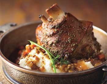 Braised and roasted pork shanks with prosciutto and porcini mushrooms