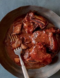 Braised beef short ribs with cider-herb reduction