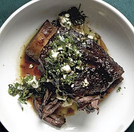 Braised beef short ribs with salsa verde and feta