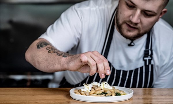 Braised butter beans with wild garlic and goat's curd