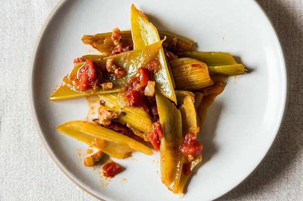 Braised celery stalks with onion, pancetta, and tomatoes