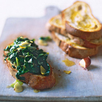 Braised chard bruschetta with lemon, garlic and caraway seeds