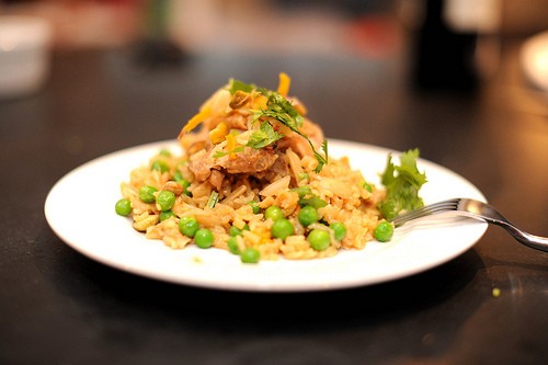 Braised chicken and rice with orange, saffron, almond, and pistachio syrup