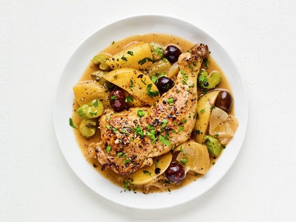 Braised chicken legs with potatoes, olives, and lemon