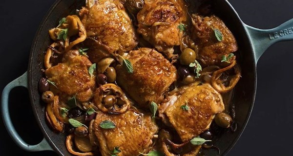 Braised chicken thighs with garlic, lemon, and Greek olives