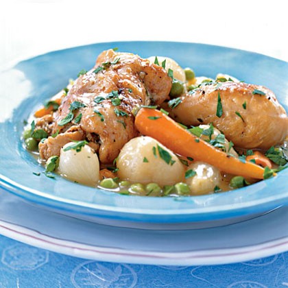Braised chicken with baby vegetables and peas