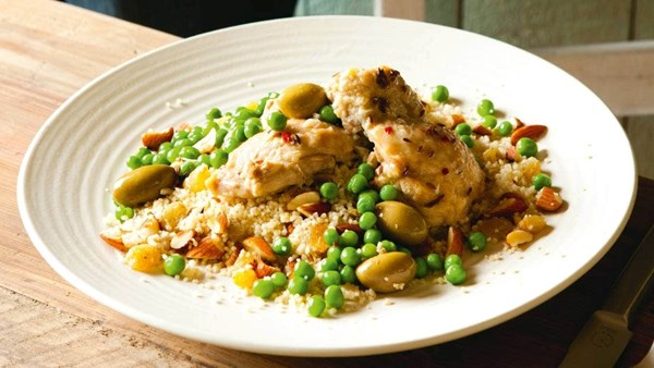 Braised chicken with green olives and peas and almond couscous