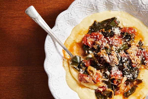 Braised collards with tomato and chicken sausage over polenta