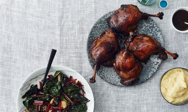 Braised duck legs with polenta and wilted chard