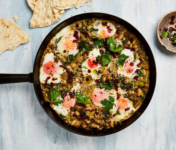 Braised eggs with leeks, cannellini beans and Iranian lime