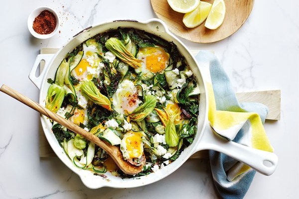 Braised eggs with zucchini, feta and lemon