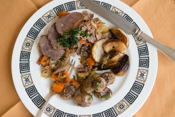 Braised goose with root vegetables and gremolata