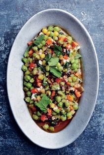 Braised green chickpeas with pomegranate & feta