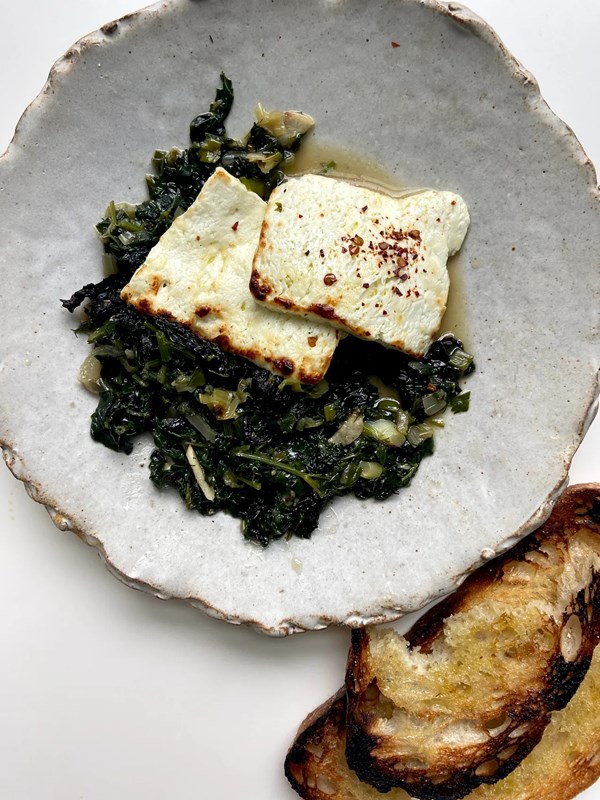 Braised greens with sizzled feta