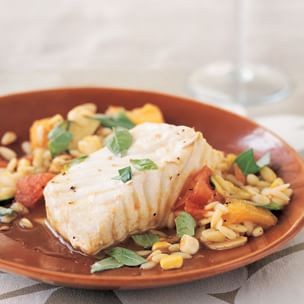 Braised halibut with summer vegetables and orzo