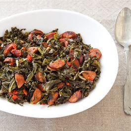Braised hearty greens with chorizo and pimentos