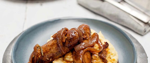 Braised Italian sausages with cheesy polenta