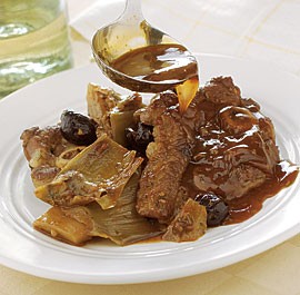 Braised lamb chops with black olives and artichokes