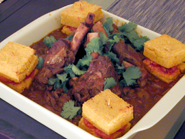 Braised lamb shanks, grilled polenta sandwiches (Souris d'agneau confites)