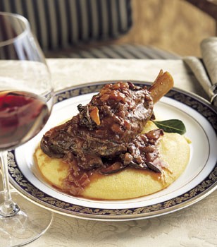 Braised lamb shanks on soft polenta with bay leaves