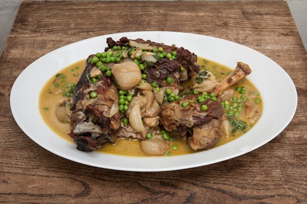 Braised lamb with peas, crème fraiche and mint