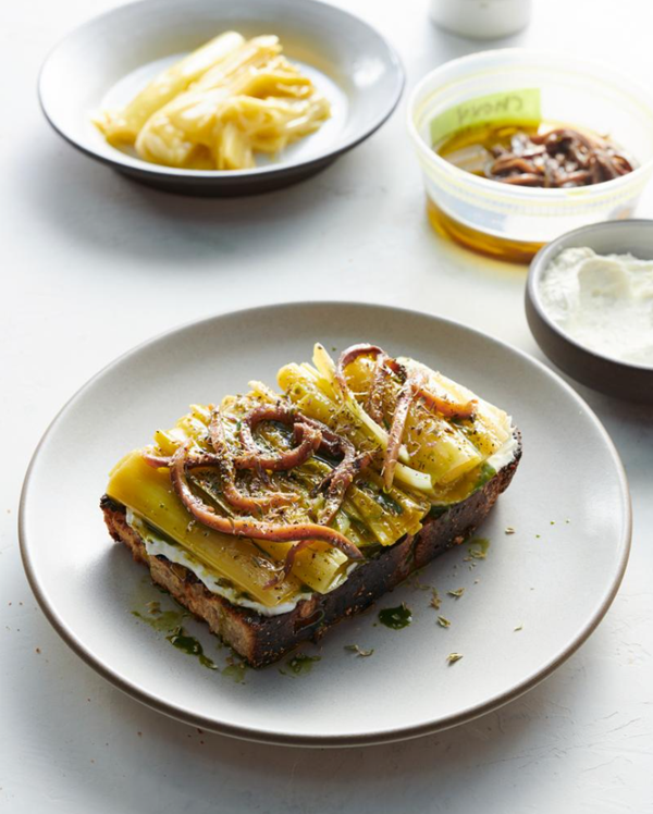 Braised leek toast with whipped ricotta, oregano oil, and Cantabrian anchovies