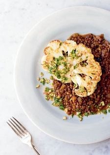 Braised lentils and cauliflower steaks with Brazil nut gremolata