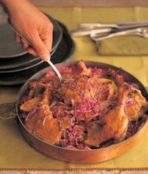 Braised or slow-roasted duck legs with red cabbage and juniper berries