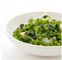 Braised peas, rocket and spring onions