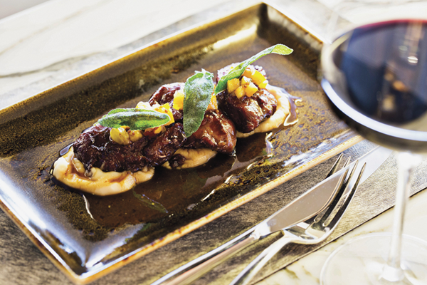 Braised pork cheeks with cannellini beans & citrus mostarda