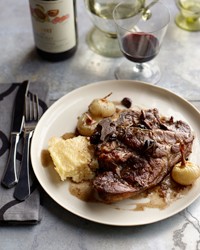 Braised pork chops with cipollini and olives