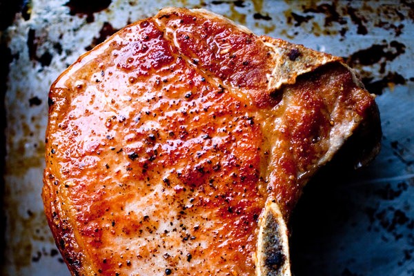 Braised pork chops with tomatoes, anchovies and rosemary
