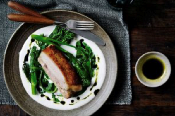 Braised pork with cheese broth and brassicas