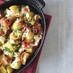 Braised potatoes and carrots with crème fraîche and prosciutto