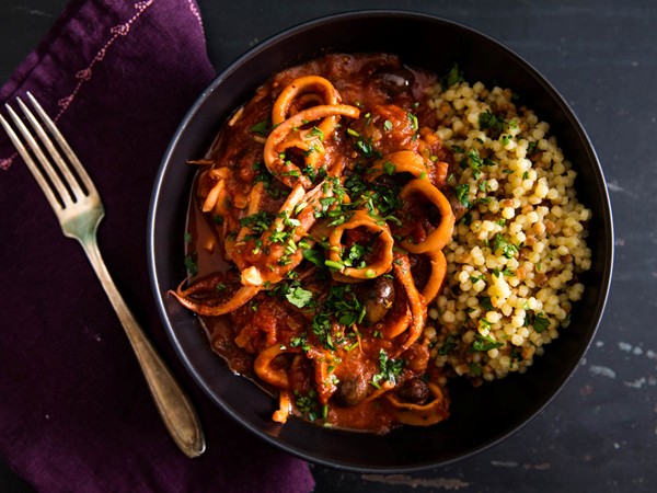 Braised squid with tomato, harissa, and olives