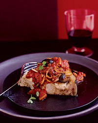 Braised swordfish with black olives, tomatoes and marjoram